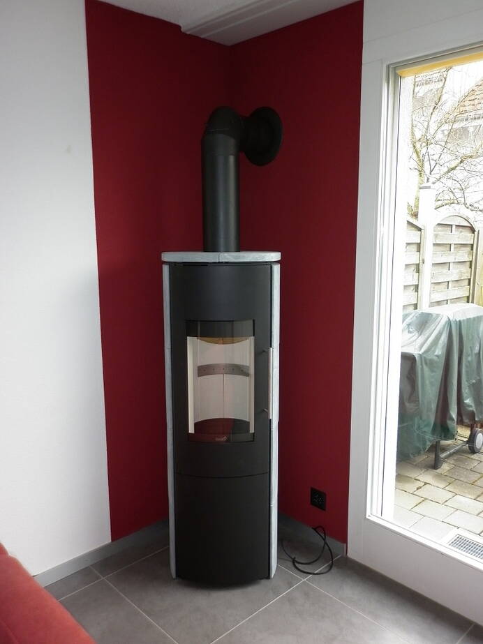 Poêle Cheminée Hark 106 H GT ECOplus Pierre naturelle, pierres d'accumulation inclus Exemple d’installation